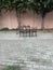 There is a tin shed in the park.  The platform is made on which people sit and eat food.