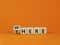 There or where symbol. Turned a wooden cube, changed the word `there` to `where`. Beautiful orange table, orange background, c