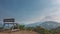 There is a wooden bench on the observation deck in the mountains.