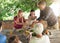 Theres more than enough for everyone. a family preparing to eat lunch together outdoors.