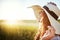 Theres no cosmetic like happiness. an attractive young woman standing outside in a field.