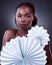 Theres no other like you, and thats your beauty. Studio portrait of a beautiful young woman posing with origami fans