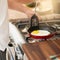 Theres nothing eggs cant do to help kickstart your morning. a young man preparing breakfast at home.