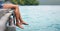 Theres nothing like some down time. an unrecognizable woman sitting and dangling her legs over the edge of a boardwalk