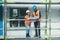 Theres room for expansion here. a young man and woman going over building plans at a construction site.