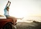 Theres something about summer that lets us free. a young woman enjoying a road trip along the coast.