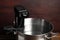 Thermal immersion circulator in pot on wooden table. Sous vide cooker