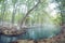 Thermal lagoon under deep sky , Blurred photo of morning fog over a lake in cold autumn weather in half moon san luis potosi