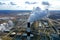 Thermal power plant. White steam from cooling tower pipes. Aerial survey from a drone.