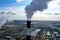 Thermal power plant. White steam from cooling tower pipes. Aerial survey from a drone.