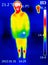 A thermographic image of a person`s body showing different temperatures in different colors, from blue indicating cold to red