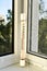 The thermometer is on the balcony on a hot summer day, the temperature is over 30 degrees Celsius.