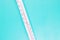 Thermometer close-up on a blue background, high temperature on the thermometer scale, meteorological equipment, air temperature me