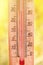 Thermometer displaying high 30 degree hot temperatures in sun summer day