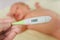 Thermometer with high temperature and sick newborn child