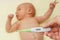 Thermometer with high temperature and sick newborn child