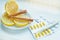 Thermometer, lemon, cinnamon, and tablets - the treatment of colds