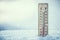 Thermometer on snow shows low temperatures under zero. Low tempe