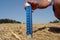 Thermometer in the soil in summer