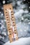 Thermometer with subzero temperature stuck in the snow