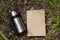 Thermos and blank craft paper lies on