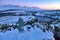 Thermos and a cup of tea at the snowy summit and scenic evening view over Lough Bray Upper lake seen from Eagles Crag