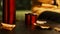 Thermos, mug of tea and autumn leaves on an old, wooden table