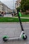 Thessaloniki, Greece - April 26 2019: A parked Lime electric Scooter rental without passenger. A green and black ride sharing Lime