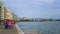 Thessaloniki, Greece - March 26, 2017: People walking on the coast in Thessaloniki next to the White tower.