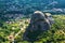 Thessaly valley with Meteora rocks and a village, Greece