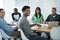 Theyre all on the same page. Portrait of young businesspeople sitting in a boardroom.