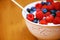 Theyre berry good for you. Closeup shot of a delicious bowl of berries in yoghurt.