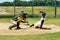 Theyre both up to the task. Full length shot of a young baseball player reaching base during a match on the field.