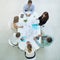 Theyre a dedicated group. High angle shot of a group of businesspeople meeting in the office.