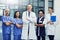 Theyre a dedicated team of healthcare professionals. Portrait of a group of smiling medical professionals standing in a
