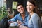 Theyre enjoying the date. Portrait of a young couple sitting in a cafe.