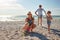 Theyre a family that loves the beach. a young family enjoying a summer day out at the beach.