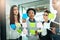 Theyre focused on their plan. coworkers using sticky notes on a glass wall during a meeting.