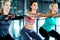 Theyre getting fitter together. three attractive young women working out together in the gym.