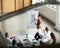 Theyre hanging on her every word. High angle shot of a group of businesspeople meeting in the boardroom.