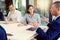 Theyre keen on sharing their insights together. a group of businesspeople having a meeting in an office.