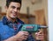 Theyre more than tools in the hands of a craftsmen. Portrait of a happy handyman holding his drill while standing in his