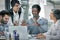 Theyre planning to strike business with a bang. Cropped shot of a group of colleagues brainstorming together on a laptop