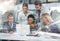 Theyre planning to take over the city. Multiple exposure shot of a group of businesspeople working together on a laptop