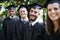 Theyre proud graduates. Portrait of a group of happy students on graduation day.