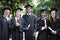 Theyre proud graduates. Portrait of a group of happy students holding their diplomas on graduation day.