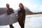 Theyre ready to hit the waves. an athletic young couple surfing at their favourite beach.