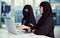 Theyre on the same page. two young arabic businesswomen working on a laptop in their office.