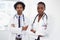 Theyre serious about being successful in medicine. Portrait of two doctors standing in a room.