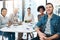 Theyre a team of innovators. Portrait of a group of colleagues sitting together in a boardroom.